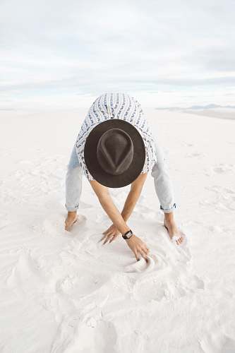 white sands person standing on sand crawling